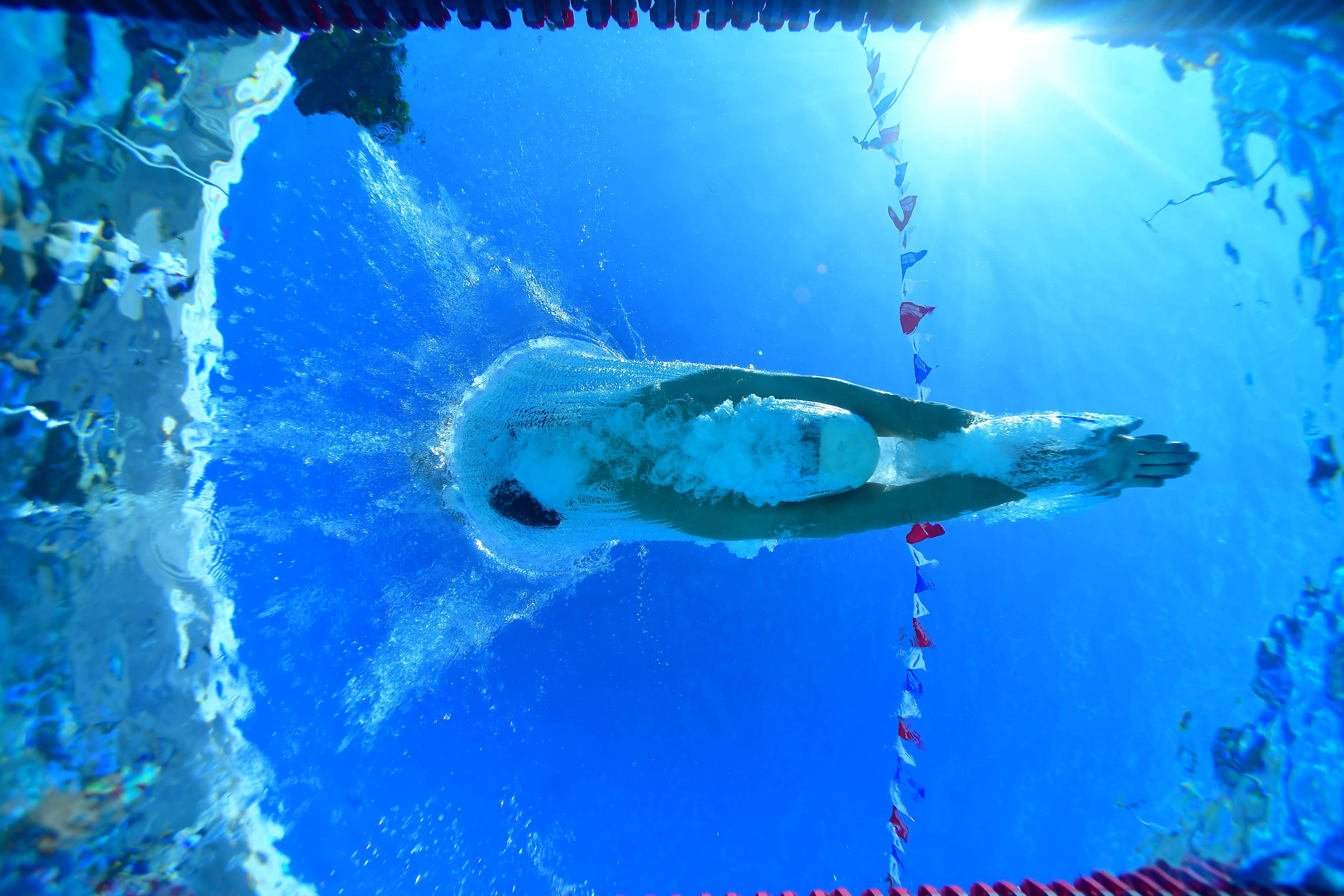 Male diving in - unnderwater